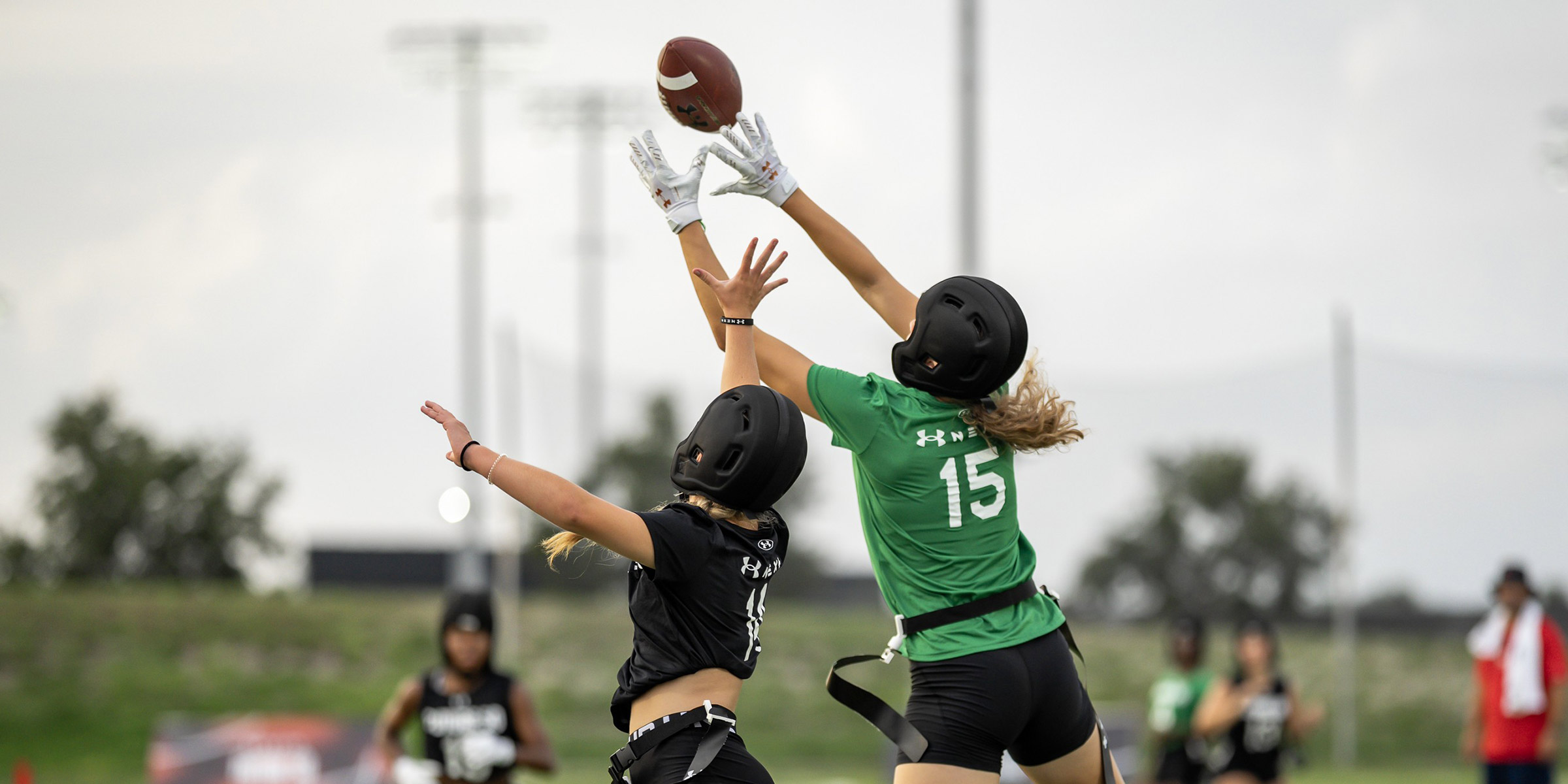 Two women playing flag football, which is one of many NCAA emerging sports